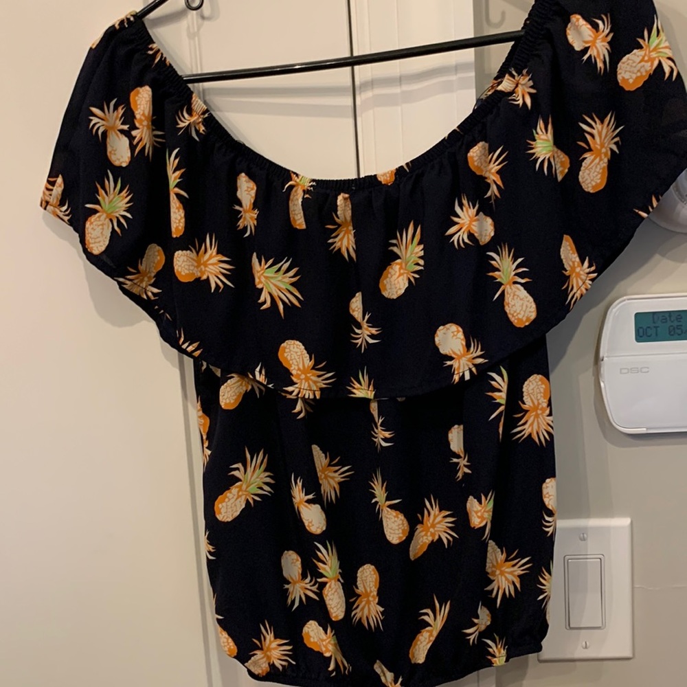 Off the should crop top .  Pineapples detailing